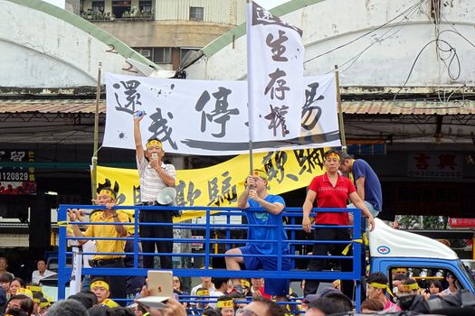 KAOHSIUNG, TAIWAN -- JULY 31 , 2017: Protesters demonstrate at the opening of a controversial new road. The construction had led to forced evictions of residents.