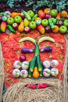Vegetables portrait. Fresh organic Vegetables on Wooden table with autumn leaves. Healthy Vegetarian food