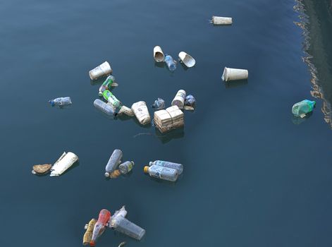 KAOHSIUNG, TAIWAN -- JUNE 2, 2019: Plastic bottles and polystyrene cups pollute Kaohsiung Harbor