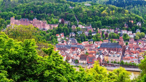 Panoramic view of beautiful medieval town Heidelberg including Carl Theodor Old Bridge, Neckar river, Church of the Holy Spirit, Germany
