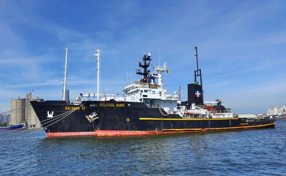 KAOHSIUNG, TAIWAN -- MAY 26, 2018: Two large ocean-going tugs are anchored in the busy port of Kaohsiung, a major trading hub for Taiwan.