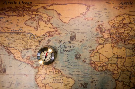 Travel concept background, vintage compas and old earth map 