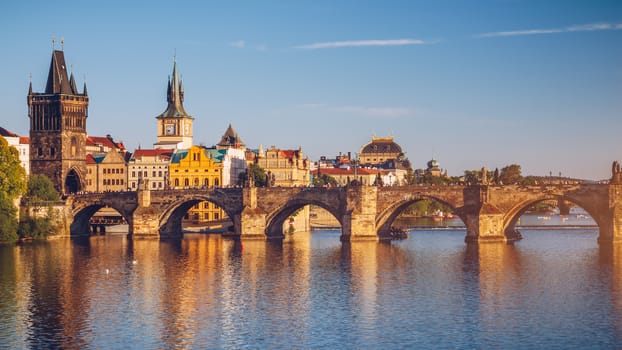 Charles Bridge (Karluv Most) and Lesser Town Tower, Prague in summer at sunset, Czech Republic
