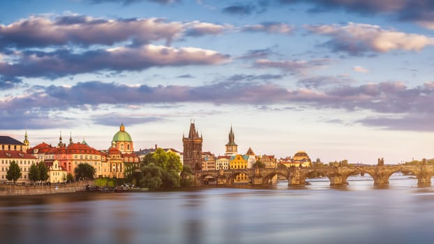 View of the Vltava River and the bridges shined with the sunset sun, Prague, the Czech Republic
