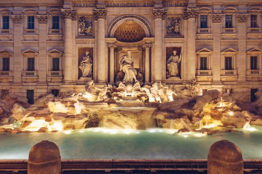 Trevi fountain at sunrise, Rome, Italy. Rome baroque architecture and landmark. Rome Trevi fountain is one of the main attractions of Rome and Italy