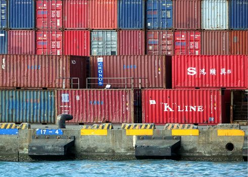 KAOHSIUNG, TAIWAN -- MAY 11, 2014: Old shipping containers are stored at a dock in Kaohsiung Harbor