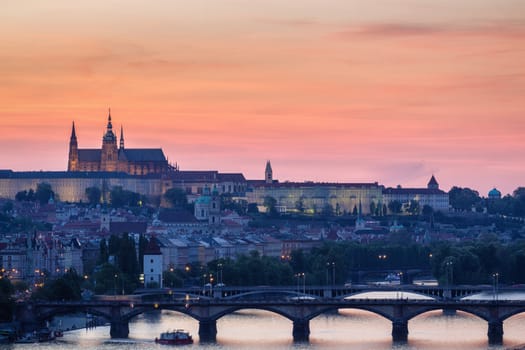 Panorama of Prague with red roofs from above summer day at dusk, Czech Republic