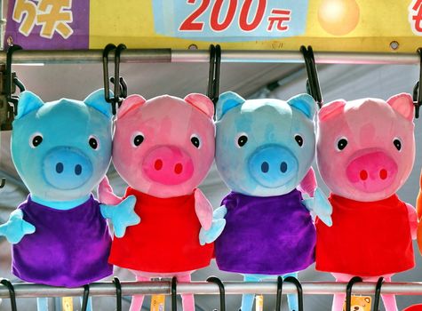 KAOHSIUNG, TAIWAN -- JANUARY 5, 2019: An outdoor skill game stall offers television animation character Peppa Pig merchandise for prizes to those who win.
