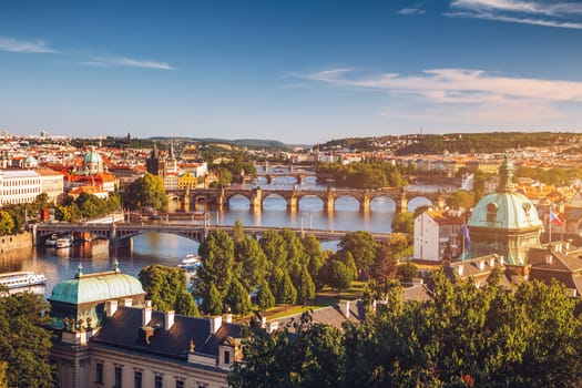 Scenic spring sunset aerial view of the Old Town pier architecture and Charles Bridge over Vltava river in Prague, Czech Republic