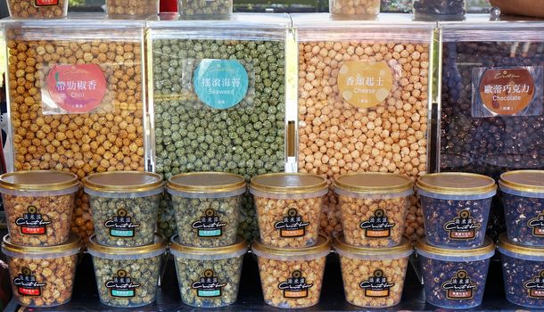 KAOHSIUNG, TAIWAN -- JUNE 7, 2019: A street vendor sells popcorn in a variety of flavors.
