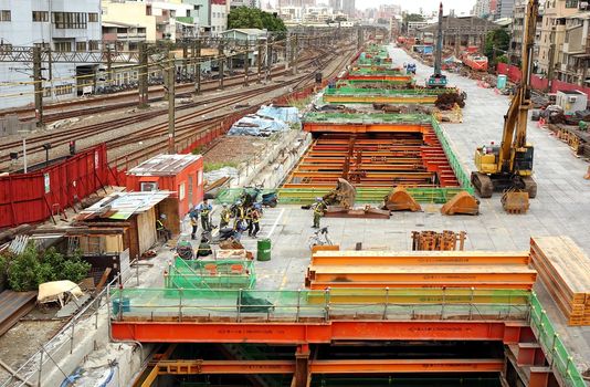 KAOHSIUNG, TAIWAN -- AUGUST 15, 2015: Large scale construction work continues on the project to move the city rail tracks underground.
