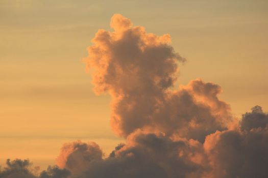 Clouds in the sky with the orange light of the sun