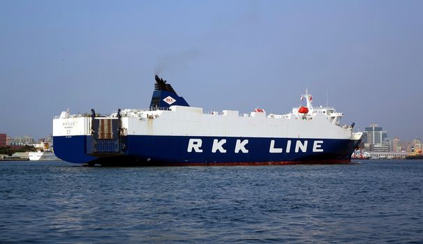 KAOHSIUNG, TAIWAN -- OCTOBER 11, 2014: A large cargo vessel of the Japanese RKK shipping line enters Kaohsiung Port.