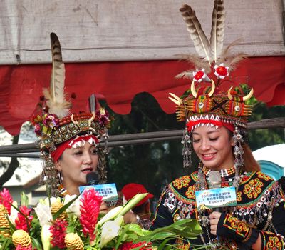 KAOHSIUNG, TAIWAN -- SEPTEMBER 28, 2019: Two young women of the indigenous Rukai tribe introduce the traditional harvest festival.
