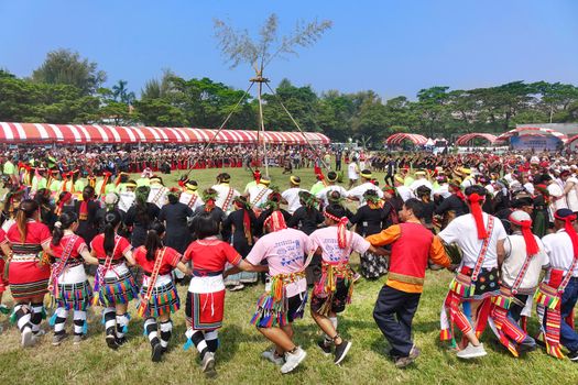 KAOHSIUNG, TAIWAN -- SEPTEMBER 28, 2019: Various indigenous tribes dance in a large circle during the traditional harvest festival.