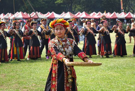 KAOHSIUNG, TAIWAN -- SEPTEMBER 28, 2019: Women of the indigenous Rukai tribe perform a dance during the traditional harvest festival.
