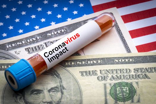 CORONAVIRUS IMPACT text, US Dollar and blood sample vacuum tube on America flags background. Covid-19 or Coronavirus Concept 