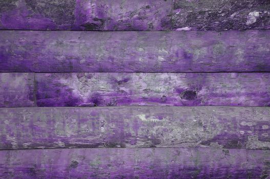 A background of old wood purple with knots.