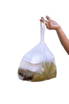 A woman's hand is holding a plastic bag to hold food