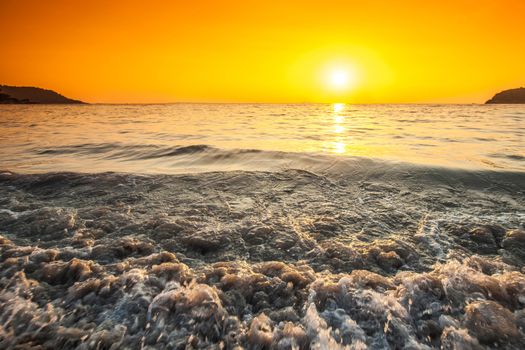 Beach and sea sunset, surf waves close up