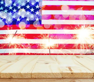 wooden table on USA flag with sparklers background celebrate American Independence Day of 4th July