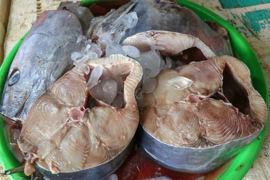 Fresh seafood on ice at the fish market. Fresh fish selling in the fish market in Jimbaran - Traditional local Pasar Ikan Kedonganan. Exotic fishes in Jimbaran fish market in Bali beach