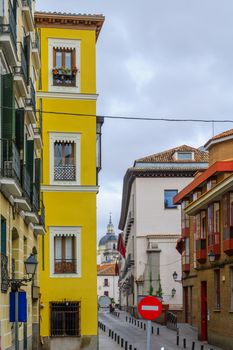 Typical street with various buildings in Madrid, Spain