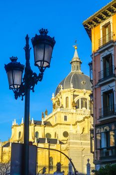 View of a street lamp and the Cathedral, in Madrid, Spain