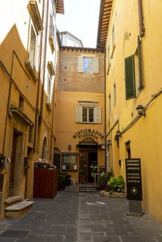 todi,italy june 20 2020 :architecture of the buildings in the village of todi between churches and glimpses of streets
