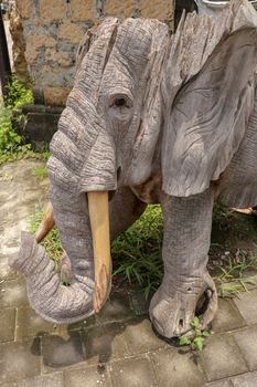 Wooden statue of an elephant. Art and work of Balinese artists. Wooden art. Elephant made of pieces of old wood. Ubud, Bali, Indonesia. March 2020.