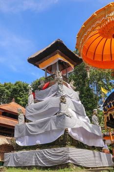 Balinese drum pavilion bale kulkul - bale kul-kul, for a slit-log drum, Bali, Indonesia. Bale kulkul at temple Pura Batukaru. Hindu religion, architecture and art. Vertical image.