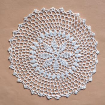 white decorated ornamental doily in white fabric