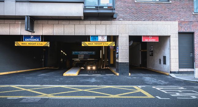 Dublin, Ireland - February 11, 2019: Entrance to underground parking in the city center on a winter day