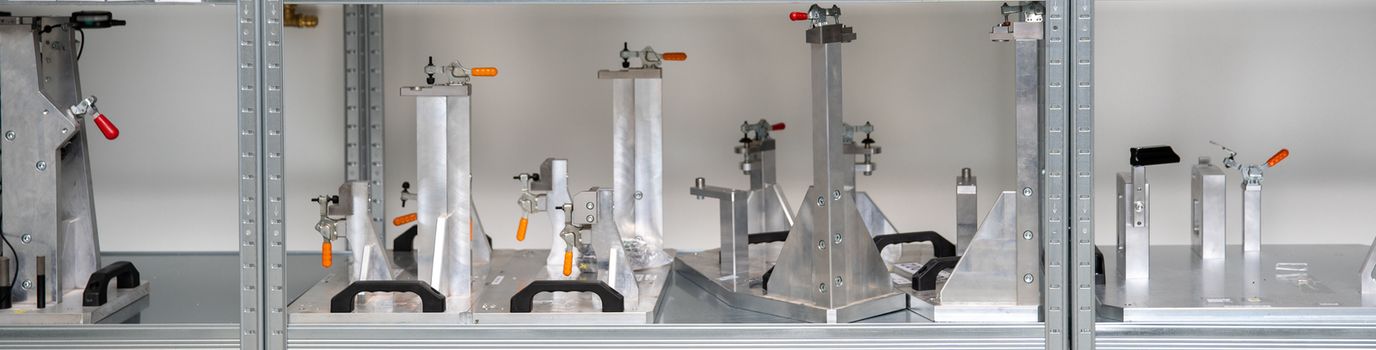 rack with tools for precise 3D measurement of plastic products for the automotive industry.