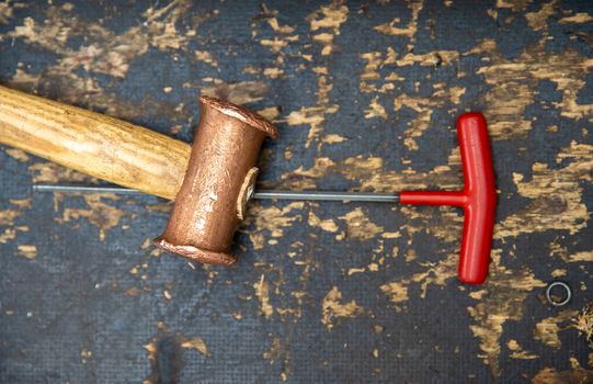 hammer and screwdriver on desk at repair shops.