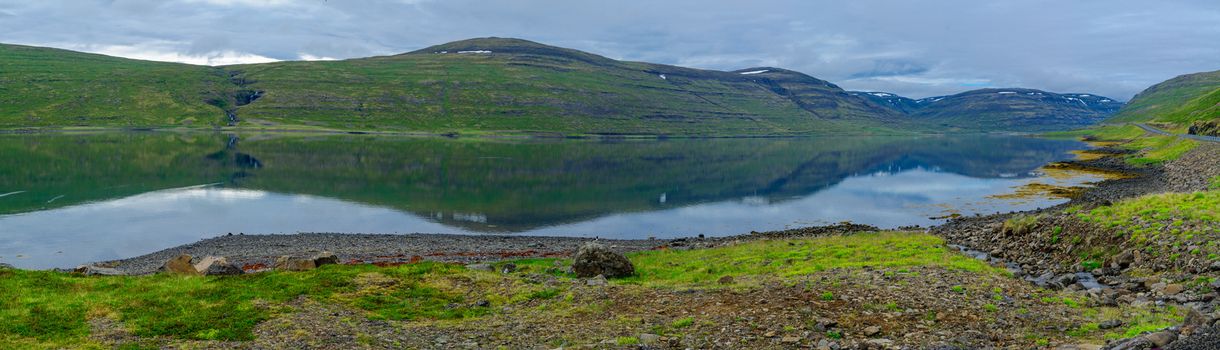 Panoramic view of coastline and landscape along the Isafjordur fjord, in the west fjords region, Iceland