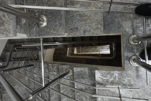 dark stairs with inox and marble.