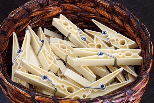 Clothespins in wicker basket