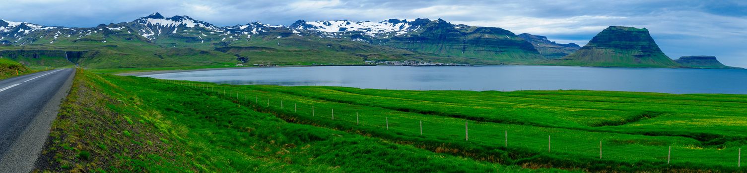 Panoramic landscape, the Kirkjufell mountain (Church mountain), and the town Grundarfjordur, in the Snaefellsnes peninsula, west Iceland