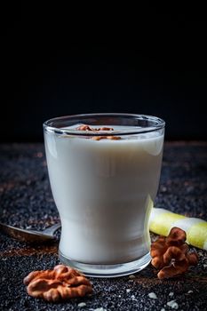 Layered greek yogurt parfait with strawberry and nut in a glass.