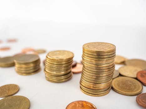 Thai Baht Coins colors Gold set in the mountains,Is the currency of Thailand.For business expenses,Coin is in a jar of money saving,White background