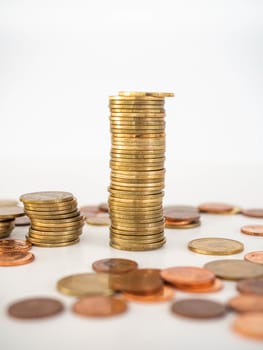 Thai Baht Coins colors Gold set in the mountains,Is the currency of Thailand.For business expenses,Coin is in a jar of money saving,White background