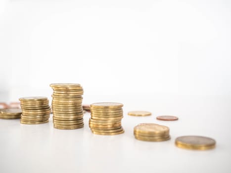 Thai Baht Coins colors Gold set in the mountains,Is the currency of Thailand.For business expenses,Coin is in a jar of money saving,White background