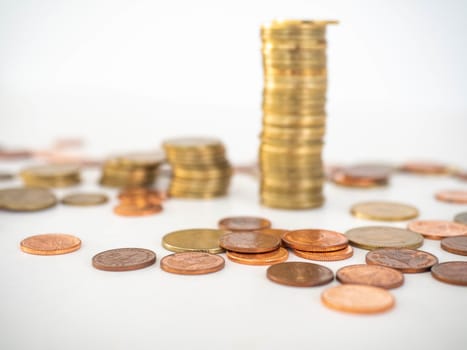 Thai Baht Coins colors Gold set in the mountains,Is the currency of Thailand.For business expenses,Coin is in a jar of money saving,White background