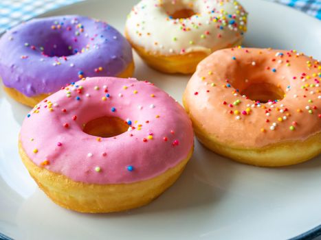 Donuts various flavor have color Orange White Purple Pink,High energy foods and healthy rates,Sweet flavored candy,Mapping background