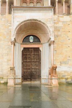 The decorated door of the Baptistery of Parma, Emilia-Romagna, Italy