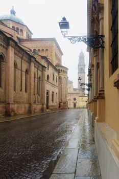 Street scene and the San Giovanni Evangelista church in Parma, Emilia-Romagna, Italy
