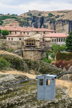 A monastery and a typical cable car in Meteora, Greece