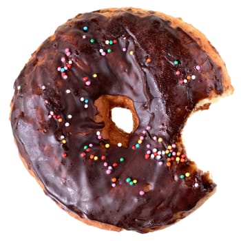 Bitten chocolate donut covered with icing isolated white background top view.