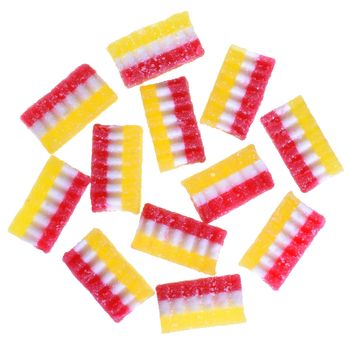 Group multicolored top view candy on a white background.